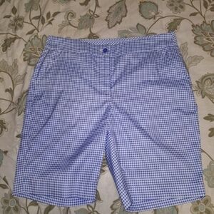 A pair of GymShark blue and white plaid flat front shorts in a ladies size 10.